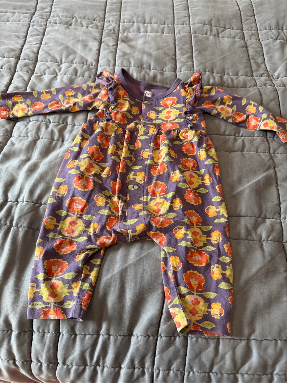 Tea Collection Purple Floral Ruffle Romper with Orange and Yellow Blooms